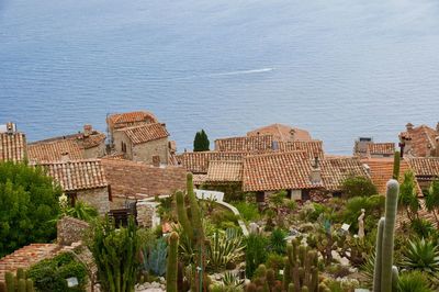 High angle view of buildings by sea