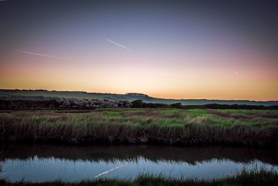 Scenic view of landscape at sunset