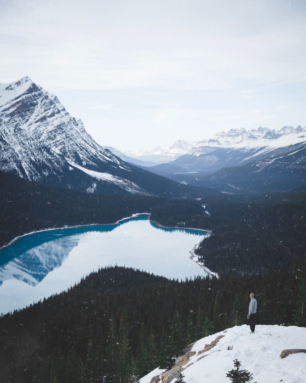 mountain, beauty in nature, scenics - nature, one person, real people, leisure activity, nature, mountain range, tranquil scene, sky, tranquility, cold temperature, non-urban scene, adventure, snow, winter, lifestyles, lake, snowcapped mountain, outdoors, looking at view