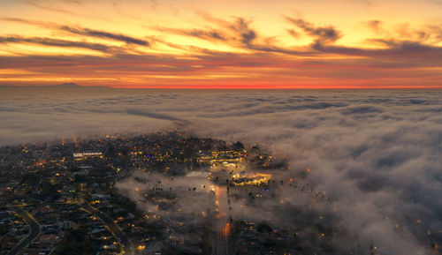 High angle view of buildings against sky during sunset