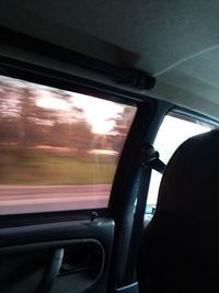 Reflection of sky seen through car window