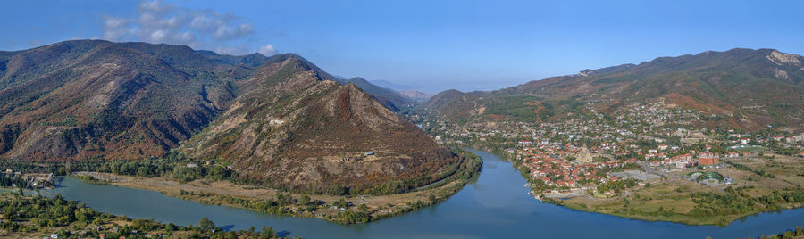 Panoramic view of lake and mountains against sky