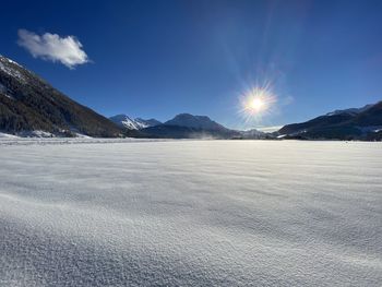 Scenic view of snowcapped mountains against sky