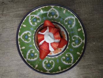 High angle view of chopped fruits in bowl on table