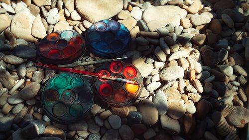 High angle view of pebbles at beach