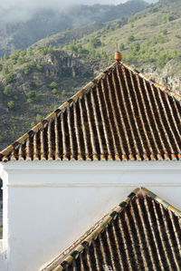 High angle view of roof and building against mountain