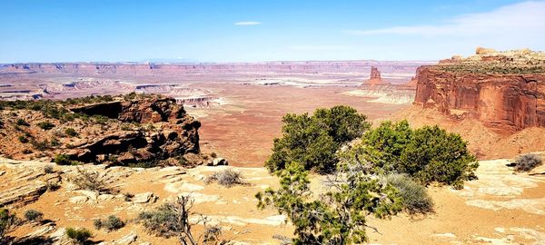 Rock formations on landscape against sky