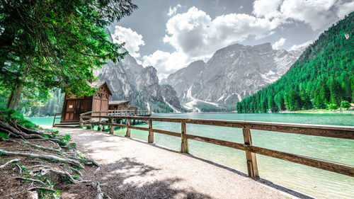 Scenic view of snowcapped mountains at lago di braies against sky