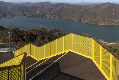 High angle view of lake by mountains