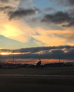 Road against cloudy sky at sunset
