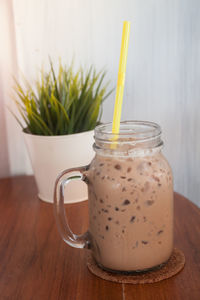 Close-up of drink in jar on table