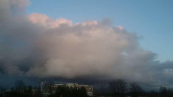 STORM CLOUDS OVER CITY AGAINST SKY