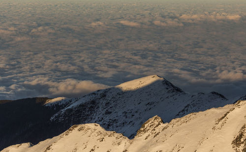 Scenic view of snowcapped mountains against sky, fagaras mountains