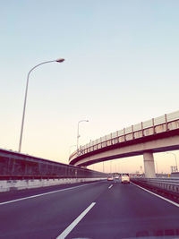 View of bridge over road against clear sky