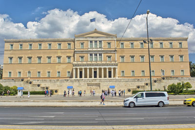 View of buildings against cloudy sky