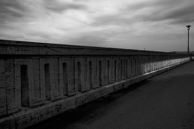 View of bridge against cloudy sky