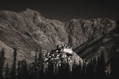 Panoramic view of tree and building against sky