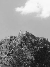Low angle view of rock formation against sky