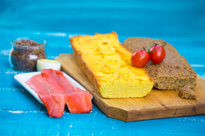 Close-up of fresh fruits in plate on cutting board