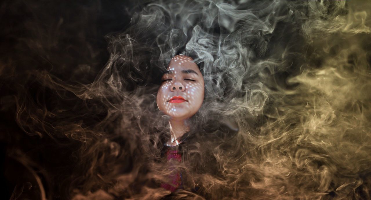 PORTRAIT OF MAN SMOKING