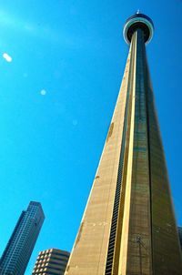 Low angle view of empire state building against clear blue sky