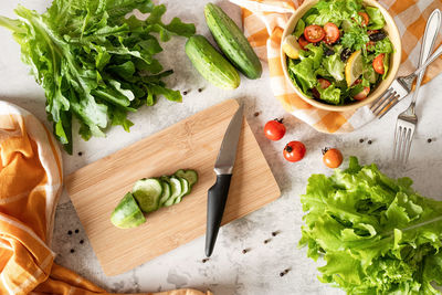 High angle view of chopped vegetables on cutting board