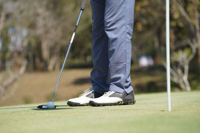 Low section of man on golf course