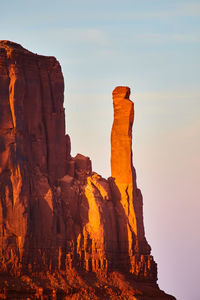 Low angle view of rock formations against sky