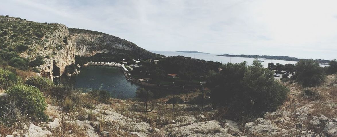 mountain, sky, tranquil scene, tranquility, water, scenics, tree, beauty in nature, nature, rock - object, cloud - sky, mountain range, non-urban scene, landscape, river, day, lake, idyllic, outdoors, no people