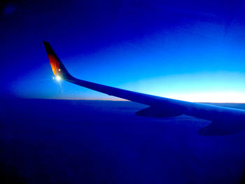 Airplane wing in sky