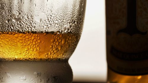 Close-up of beer glass on table