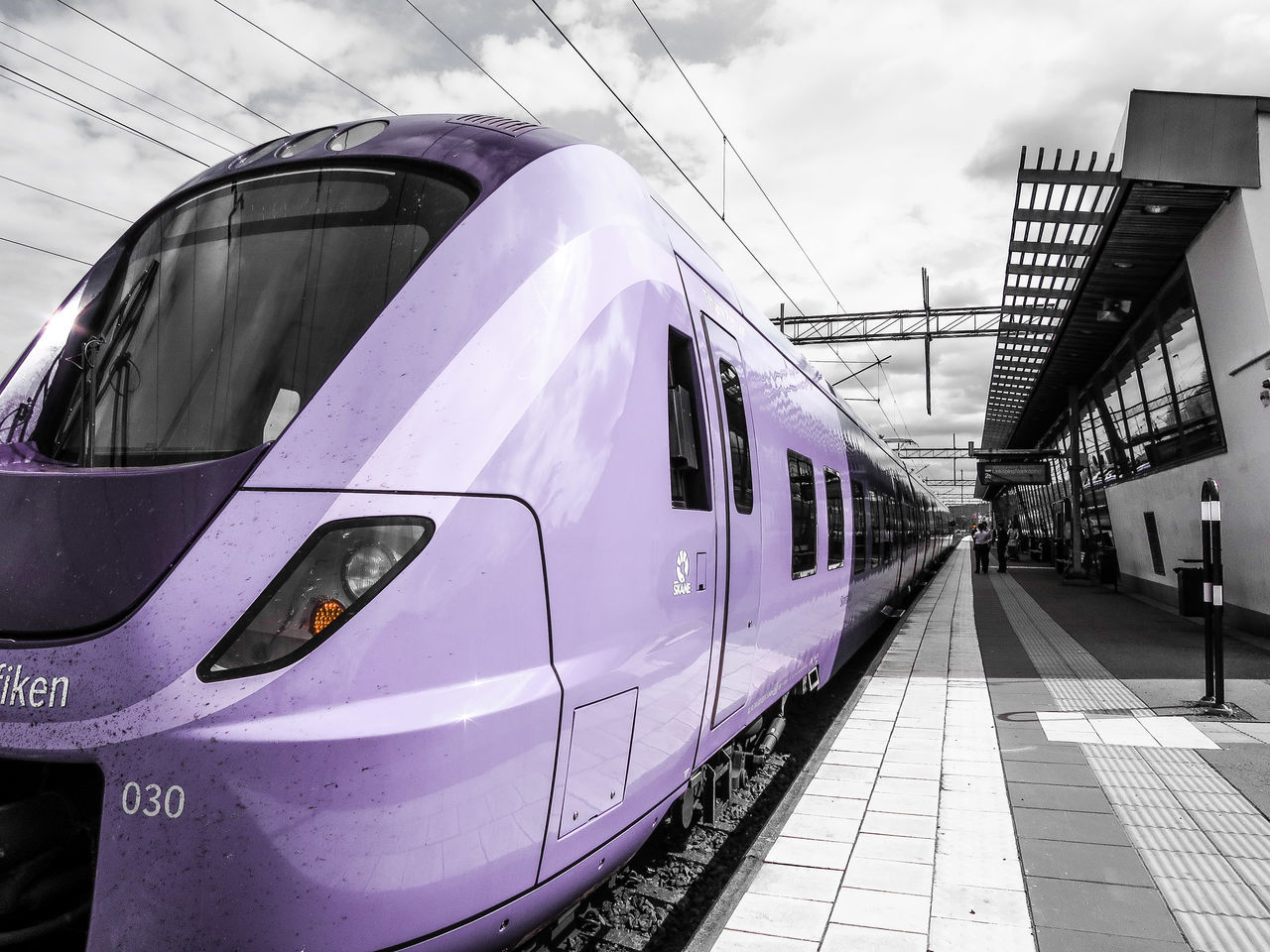 transportation, mode of transport, sky, the way forward, railroad track, public transportation, diminishing perspective, built structure, building exterior, architecture, rail transportation, vanishing point, travel, railroad station platform, car, railroad station, train - vehicle, cloud - sky, land vehicle, day