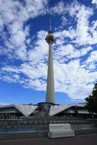 Low angle view of building against cloudy sky