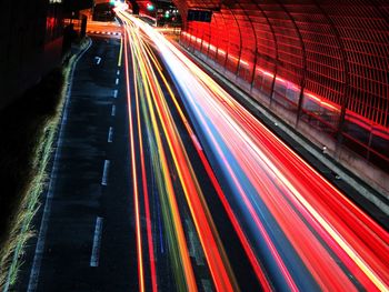 High angle view of light trails on road at night