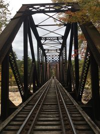 Mid distance of man walking on railway bridge