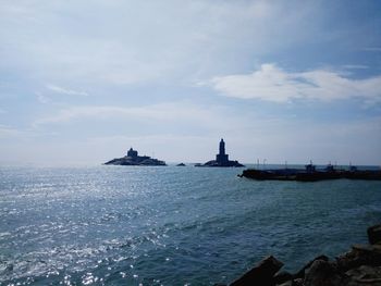 Scenic view of sea against cloudy sky