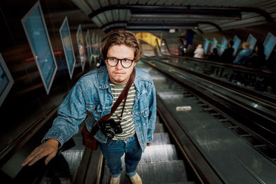 Man standing at railroad station