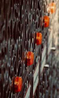 Close-up of traffic lights hanging in building