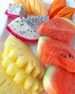 Close-up of chopped fruits in plate