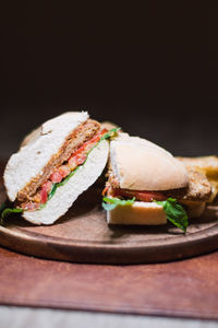 Close-up of breakfast on table against black background