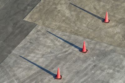 High angle view of red umbrella on floor in city