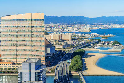 High angle view of city buildings by river