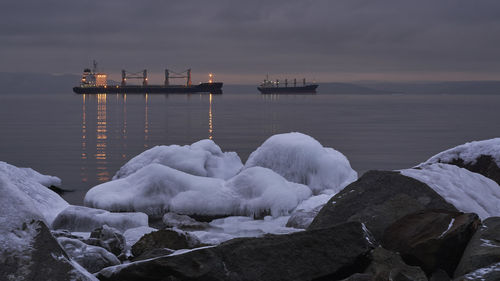 Scenic view of sea against sky during winter