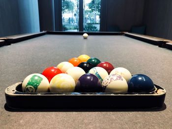 Multi colored balls on pool table
