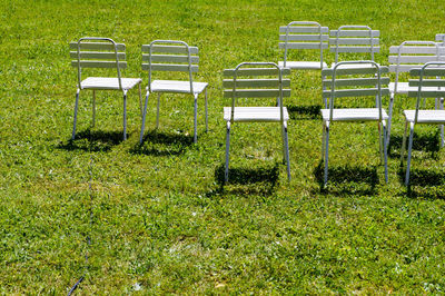 Chairs on grassy field