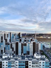 High angle view of buildings in city against sky