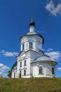 Low angle view of building against blue sky