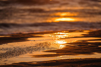 Scenic view of beach against sky during sunset