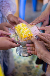 Midsection of woman holding ice cream