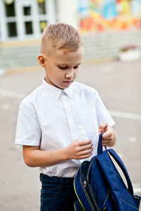 Full length of boy looking at camera